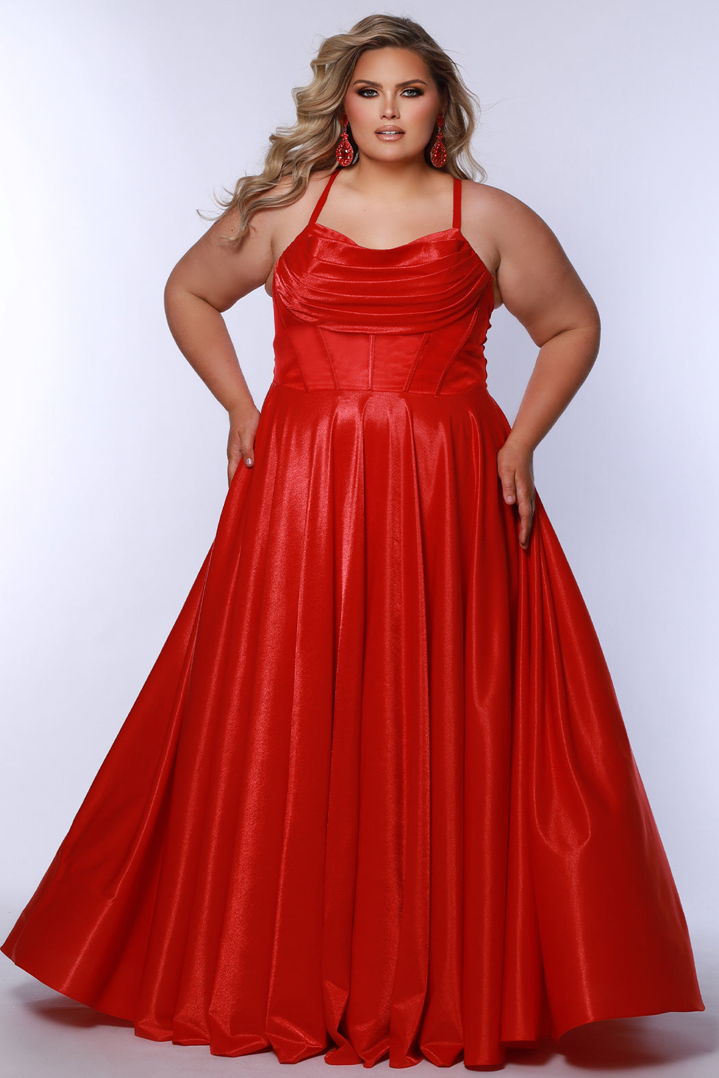 Tease Prom style TE2532 is available in black, blue, pink, purple or red in plus sizes 14-32.  Pleated draped bodice with exposed boning and optional bodice lining. Full A-line skirt with pockets. Straps go into lace up ties with modesty panel on the back. 