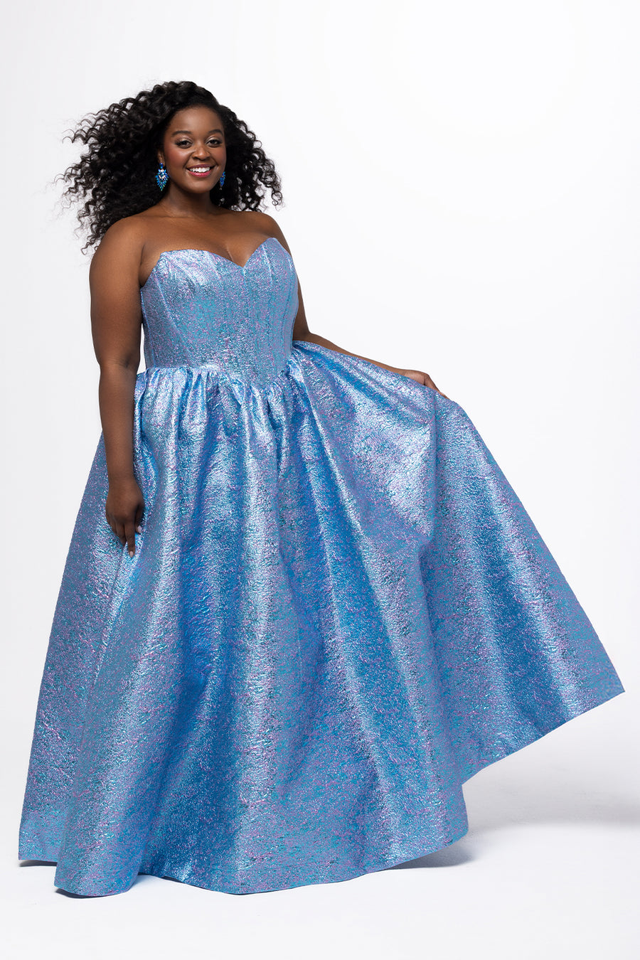 Tease Prom for Sydney's Closet style TE2538 available in amethyst purple and topaz blue. Plus size ballgown with strapless sweetheart bodice, exposed boning, basque waist and full A-line skirt with pockets. Lace up back with modesty panel and ties.