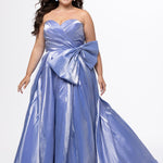 Tease Prom style TE2603 in periwinkle purple. 

Sweetheart strapless plus size A-line gown. Pleated bodice with optional bow at natural waistline. Horsehair hem and center back zipper.  Available in sizes 14-32. 