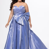 Tease Prom style TE2603 in periwinkle purple. 

Sweetheart strapless plus size A-line gown. Pleated bodice with optional bow at natural waistline. Horsehair hem and center back zipper.  Available in sizes 14-32. 
