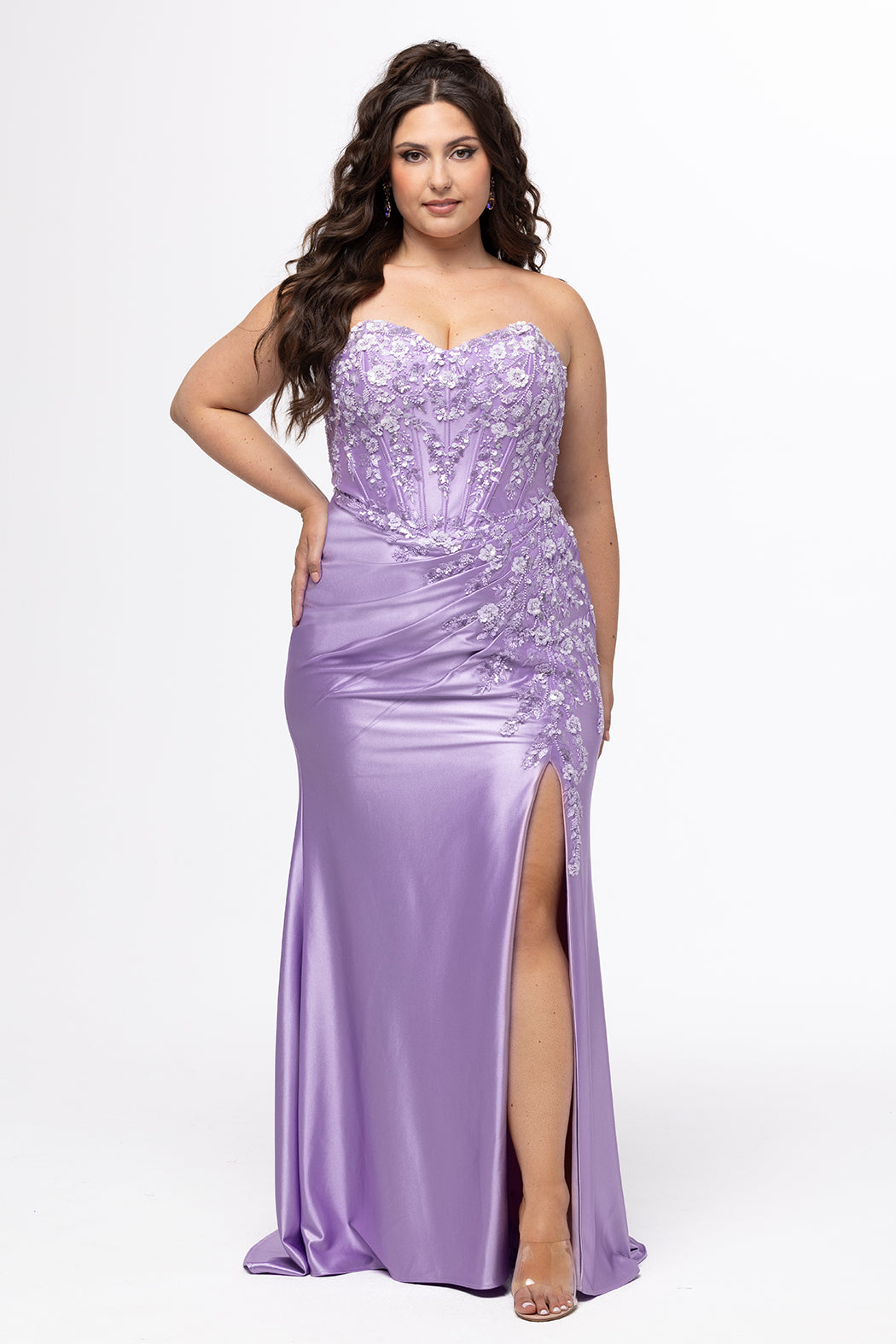 Tease Prom style TE2608 in Orchid Purple.

Strapless sweetheart plus size fitted gown. Exposed boning with 3D floral appliques and sequin detail on stretch satin. Basque waist, ruched skirt and left leg slit. Lace up back with half zipper, sweep train. Available in sizes 14-28 in Capri Blue and Orchid Purple. 