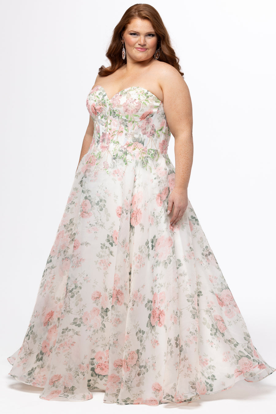 Tease Prom style TE2609 in floral. 

Strapless sweetheart plus size floral gown. Exposed boning with floral sequin detail. Organza A-line skirt with no slit. Center back zipper. Available in sizes 14-28. 