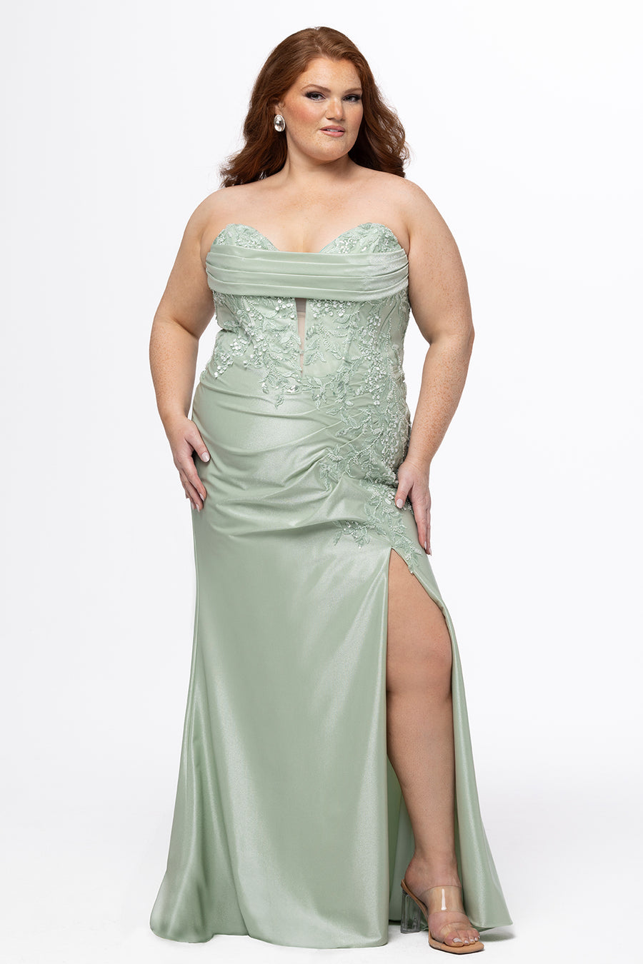 Tease Prom style TE2610 in sage green. 

Strapless, deep v-neckline plus size fitted gown. Stretch satin fabric with draped bodice detail and floral sequin appliques. Left leg slit and center back zipper. Available in sizes 14-24. 