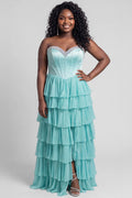 A teen modeling a strapless formal dress with a beaded sweetheart neckline, exposed corset boning, basque waistline and a full tiered chiffon ruffle skirt, photographed against a light gray studio background.

TE2611 in seafoam green by Tease Prom, exclusively plus size prom dresses designed by Sydney's Closet.