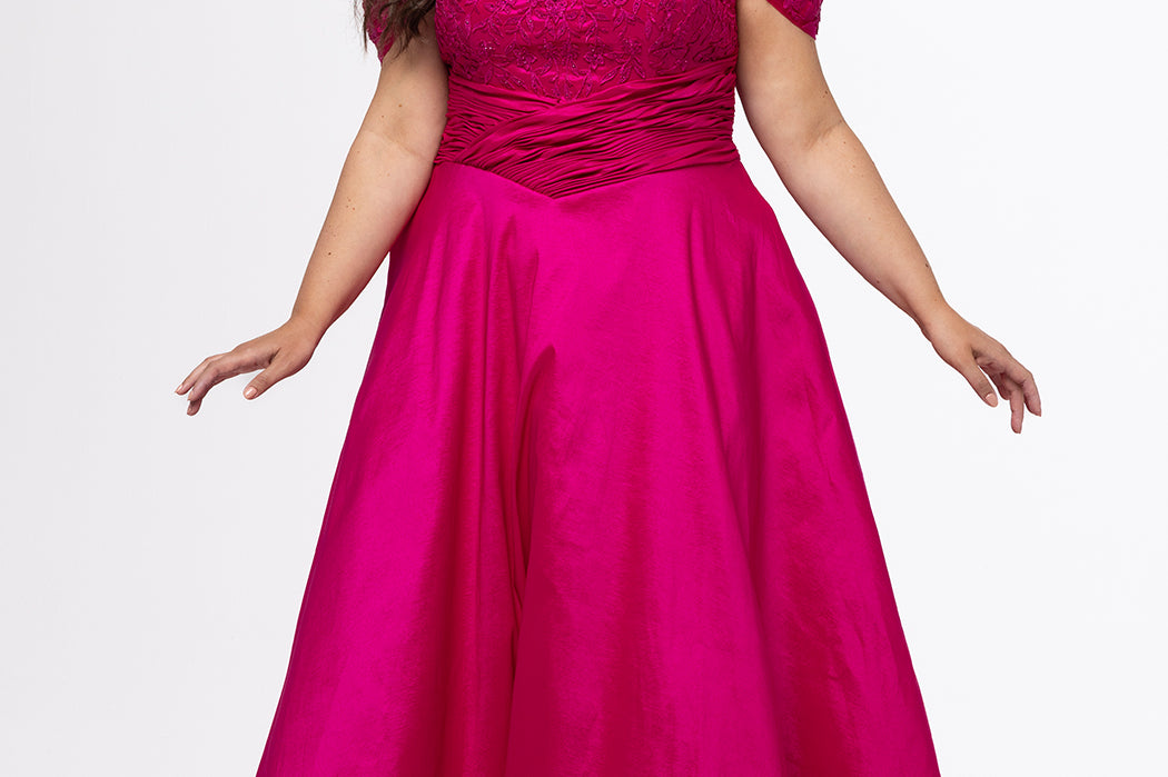Tease Prom style TE2615 in Magenta. 

Strapless taffeta plus size A-line gown. Lace covered sweetheart bodice with ruched basque waist.  Off-the-shoulder lace covered straps, lace up back and pockets. Available in sizes 14-32. 