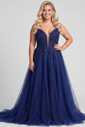 Teen modeling tulle and lace evening gown with a deep V-neckline and slit on a white background.

TE2616 in navy blue by Tease Prom, exclusively plus size prom dresses designed by Sydney's Closet.