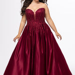 Tease Prom style TE2619 in Burgundy. 

Strapless sweetheart plus size satin ballgown. Deep v neckline with mesh insert. Exposed boning, heavy beaded detail and natural waistline. Pleated A-line skirt with crinoline. No slit, lace up back and half zipper. Available in sizes 14-32 in Burgundy, Black and dark blue. 