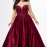 Tease Prom style TE2619 in Burgundy. 

Strapless sweetheart plus size satin ballgown. Deep v neckline with mesh insert. Exposed boning, heavy beaded detail and natural waistline. Pleated A-line skirt with crinoline. No slit, lace up back and half zipper. Available in sizes 14-32 in Burgundy, Black and dark blue. 