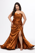 Tease Prom style TE2624 in Copper. 

Strapless satin plus size gown. Sweetheart neckline, Pleated bust overlay, Exposed boning on front and back bodice, Lace up back with modesty panel and lace up ties, Asymmetrical waistline with knot. Slim fitted skirt with ruching and slit, Sweep train with godet. Available in sizes 14-28 in royal, teal and copper. 