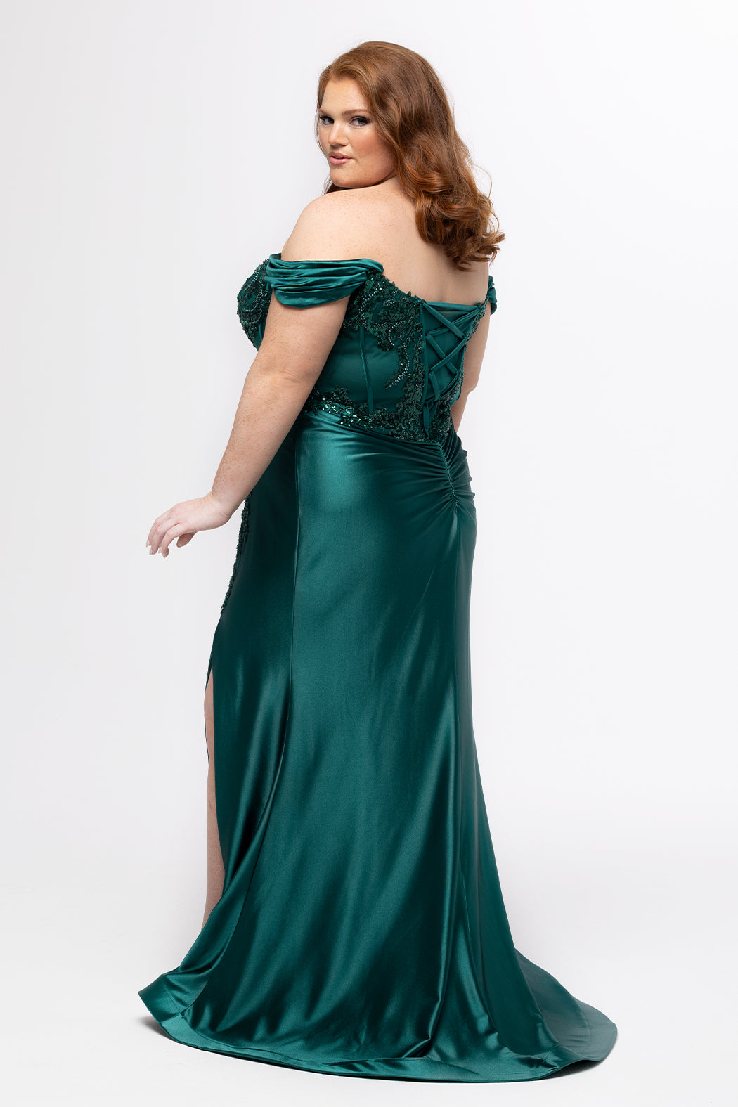 Tease Prom style TE2625 in Emerald. 

Strapless satin fitted plus size gown.  Stretch satin, Sequin appliques, Bugle beads and circle beads. Sweetheart neckline with Detachable drape sleeves, pleated. Optional bodice lining and Exposed corset boning. Basque waistline and Ruched bum. Fitted skirt with Slit on left leg. Lace up back with half zipper. Available in Emerald green, Navy blue, Lipstick pink and Black sizes 14-28. 