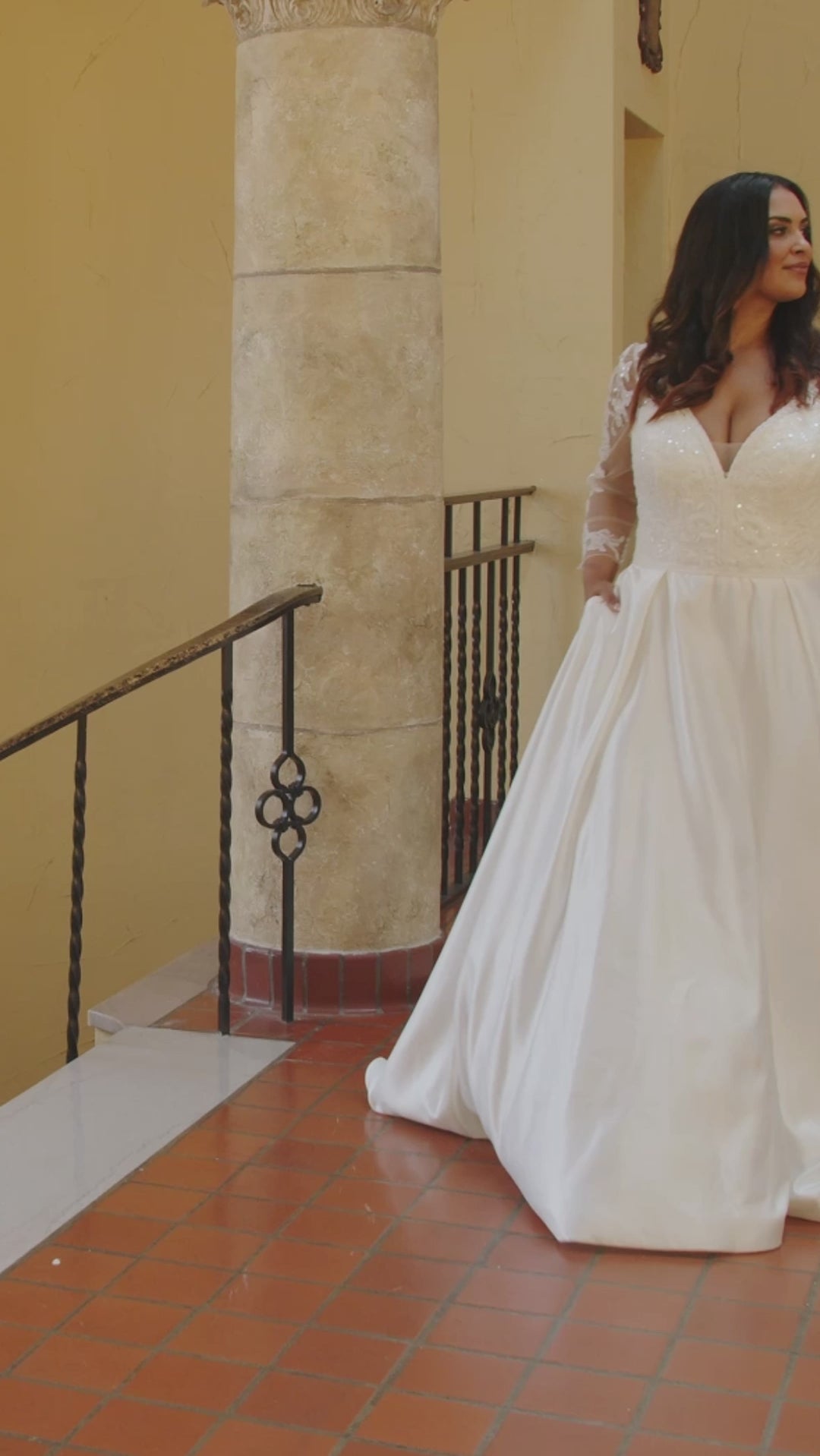 Michelle Bridal MB2418 Ivory/Nude. Floral lace over net, Satin, floral appliques with bugle beads, clear sequins and pearls, A-line silhouette, V-neckline with beaded trim, natural waistline, illusion back with appliques, invisible center back zipper, pockets, box pleats. 