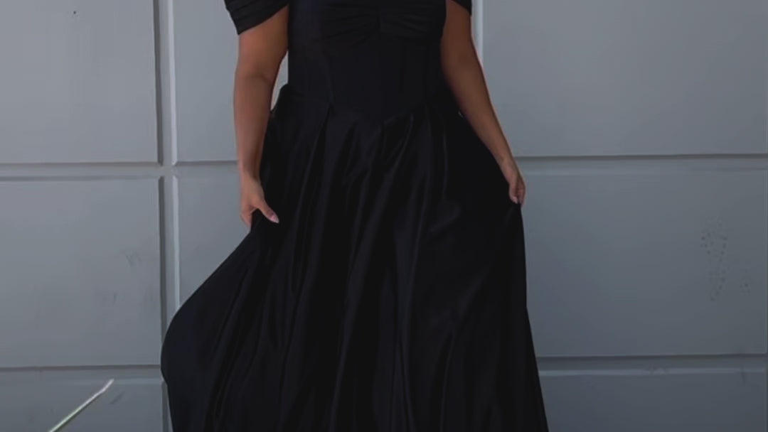 Long formal satin ballgown style SC7400 by Sydney's Closet. Available in sizes 14-32 in colors cobalt blue, onyx black and ruby red.  Pleated bodice with exposed boning, detachable pleated drape sleeves, basque waist and pockets.  