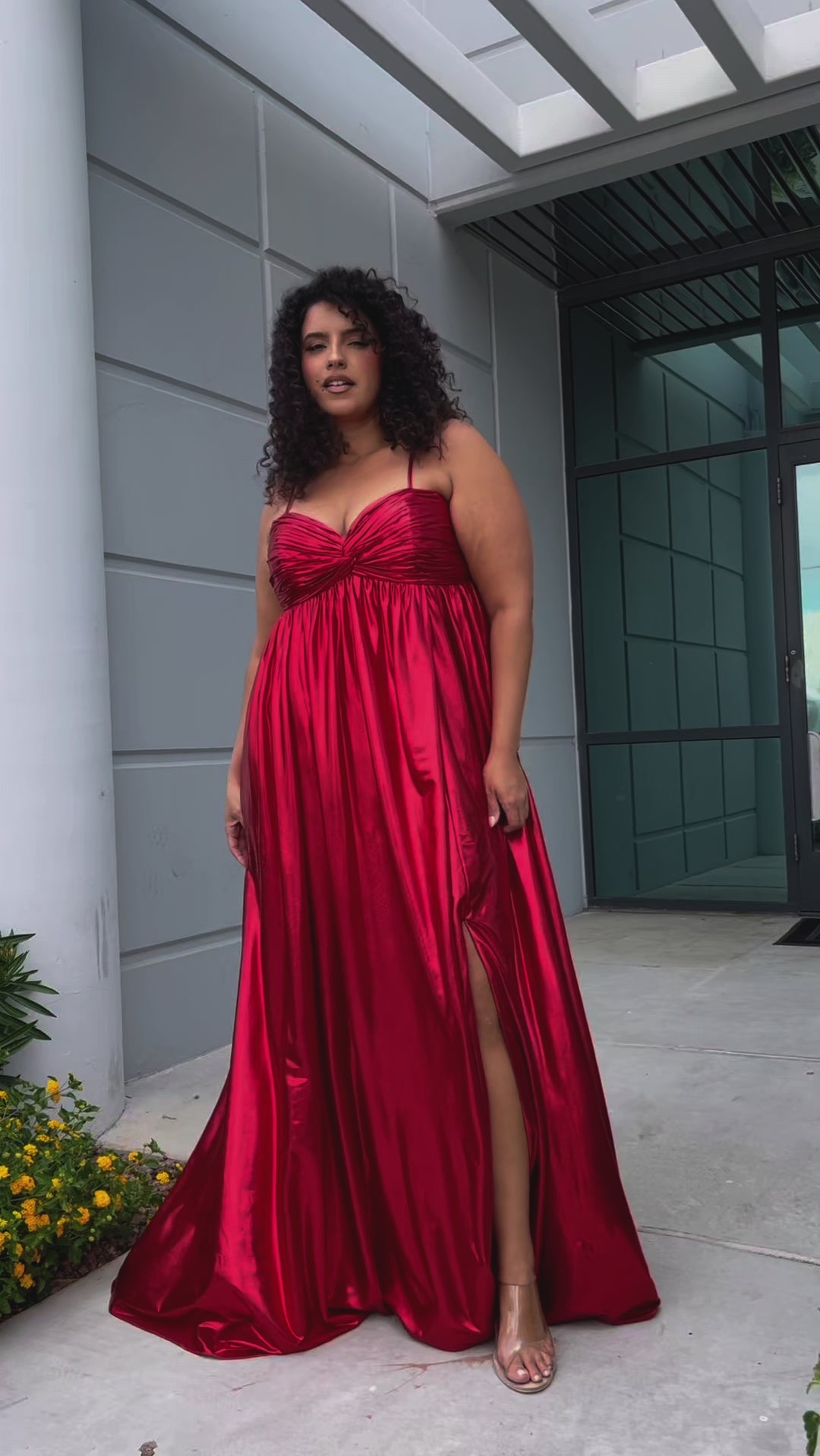 Empire plus size formal dress with spaghetti straps, pleated bodice with knot detail, pockets and slit. Available in gold, onyx black and ruby red. SC7414 by Sydney's Closet