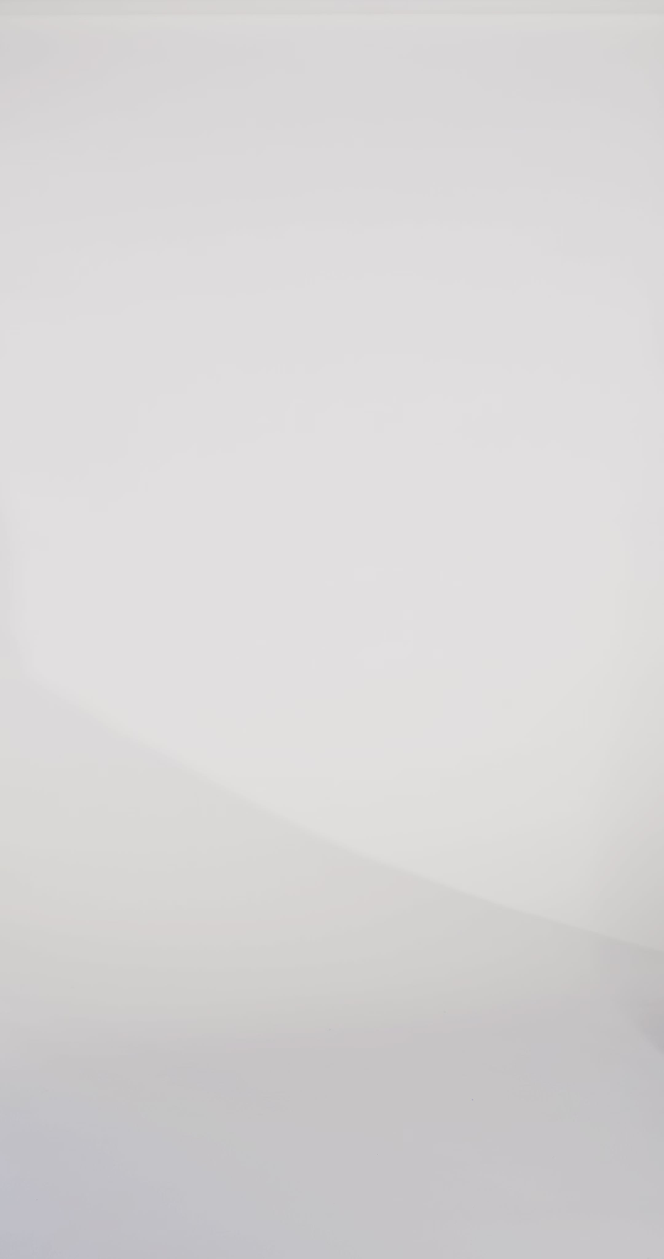 Woman models a blue sparkly tulle ballgown with straps and beaded glitter appliqués, turning to show the back before walking off screen.