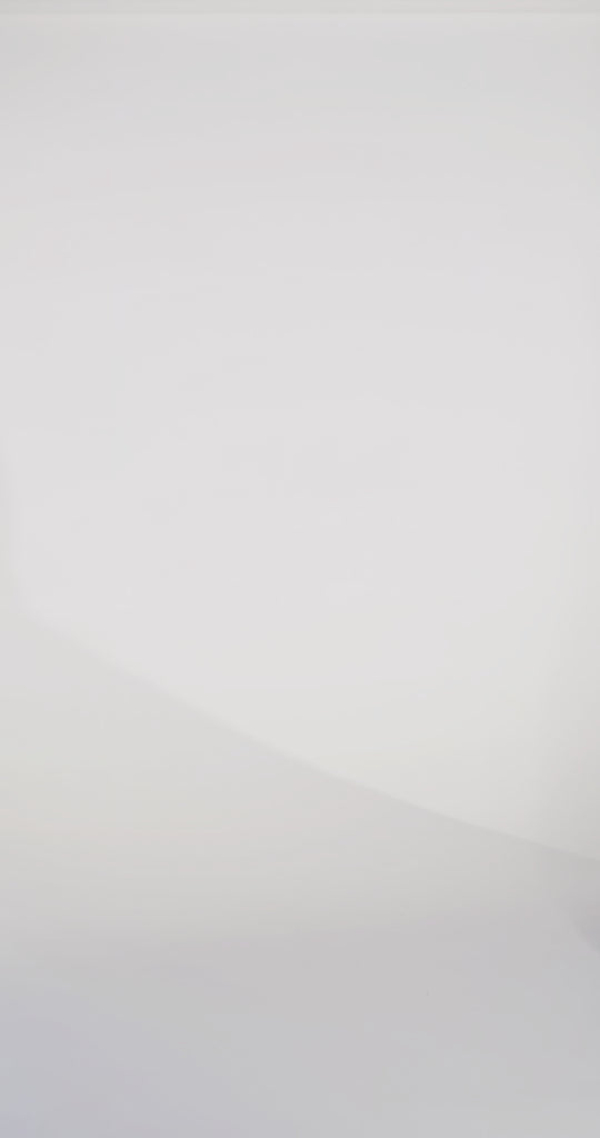 Woman models a blue sparkly tulle ballgown with straps and beaded glitter appliqués, turning to show the back before walking off screen.