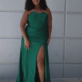 Sparkle stretch lycra plus size formal dress.  Strapless sweetheart neckline, basque waistline, exposed corset boning on bodice, ruchsed fitted skirt with high slit and zipper back. Available in sapphire blue, emerald green and onyx black. SC7412 by Sydney's Closet