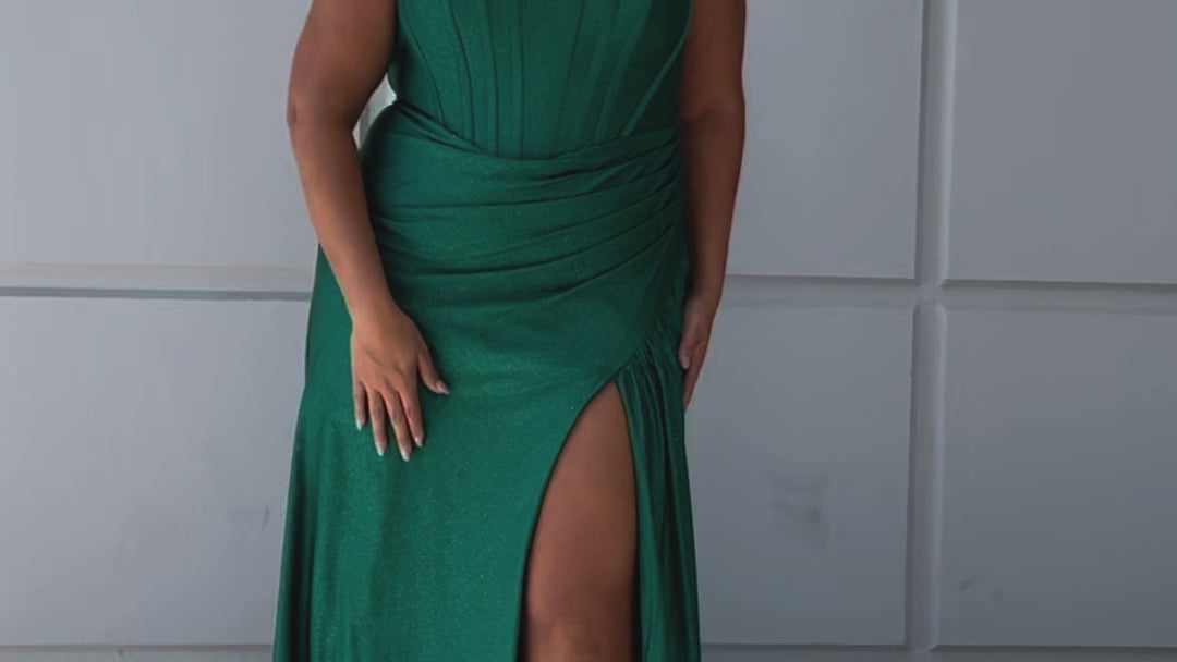 Sparkle stretch lycra plus size formal dress.  Strapless sweetheart neckline, basque waistline, exposed corset boning on bodice, ruchsed fitted skirt with high slit and zipper back. Available in sapphire blue, emerald green and onyx black. SC7412 by Sydney's Closet