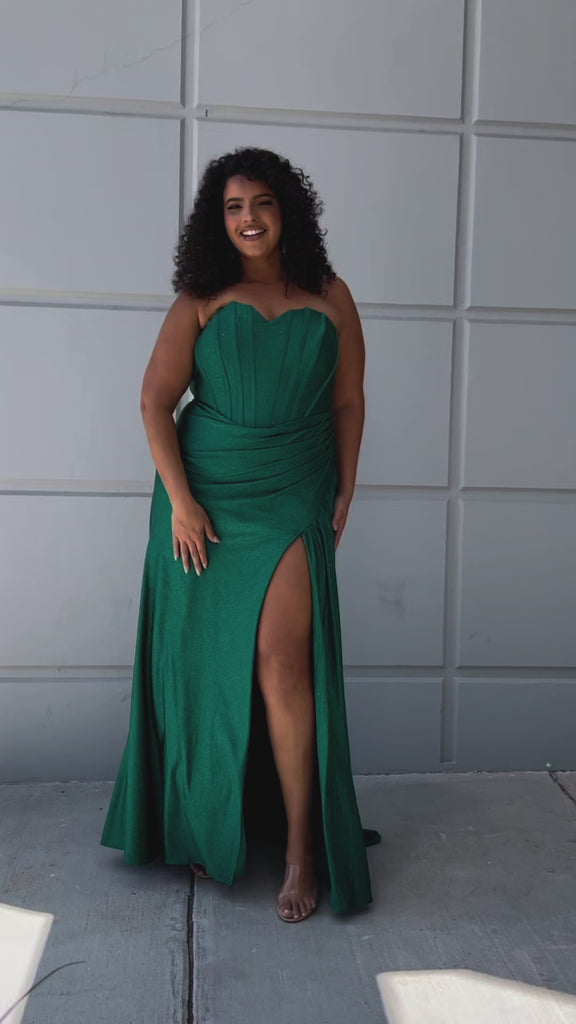 Sparkle stretch lycra plus size formal dress.  Strapless sweetheart neckline, basque waistline, exposed corset boning on bodice, ruchsed fitted skirt with high slit and zipper back. Available in sapphire blue, emerald green and onyx black. SC7412 by Sydney's Closet