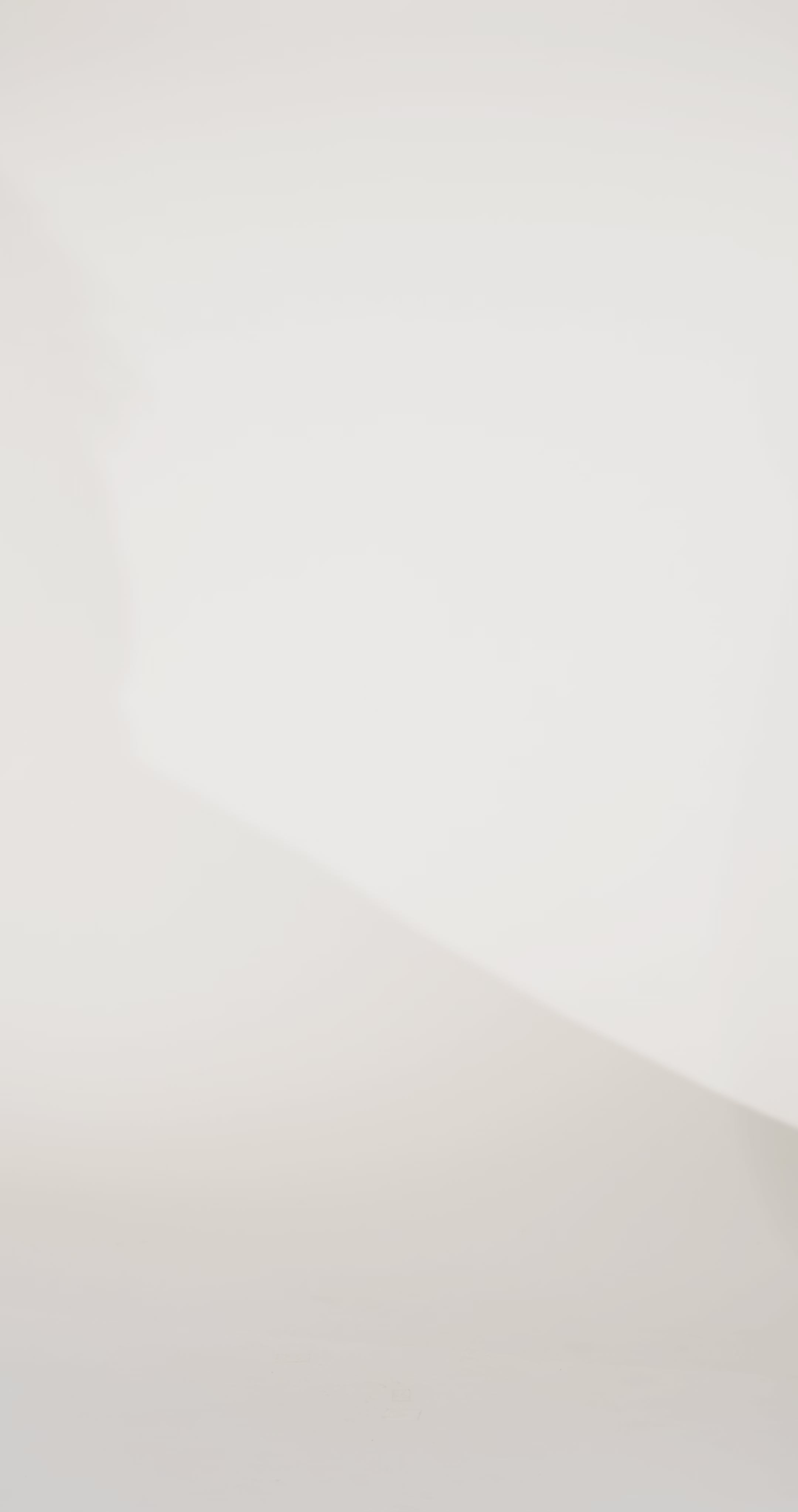 Woman models a strapless black A-line gown with a subtle floral pattern, showing the front and back before walking off screen.