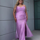 Slim fitted stretch satin plus size formal prom dress.  Pleated bodice, ruched skirt with gathered ties on slit, spaghetti straps and ruched back skirt with train.  Availablie in light blue, orange and lilac in sizes 14-24. Style SC7422 by Sydney's Closet. 