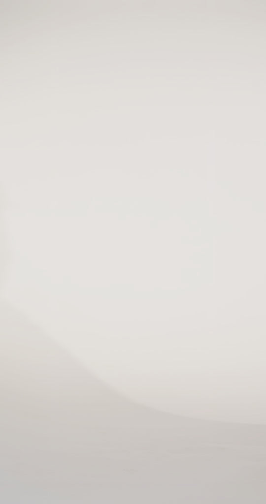 Woman models a pink off-the-shoulder slim dress with a high slit, draped panel, and lace and sparkle detailing on the bodice, waving the drape panel and turning to show the lace-up back before walking off screen.