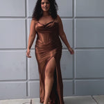 Simple plus size satin slim a-line fitted dress.  Spaghetti straps, pleated bodice, exposed boning corset with basque waistline.  Slim, fitted skirt with ruching. Lace-up back with modesty panel and sweep train.  Available in cherry red, chocolate brown, hunter green and onyx black. Sydney's Closet plus size style SC7426.