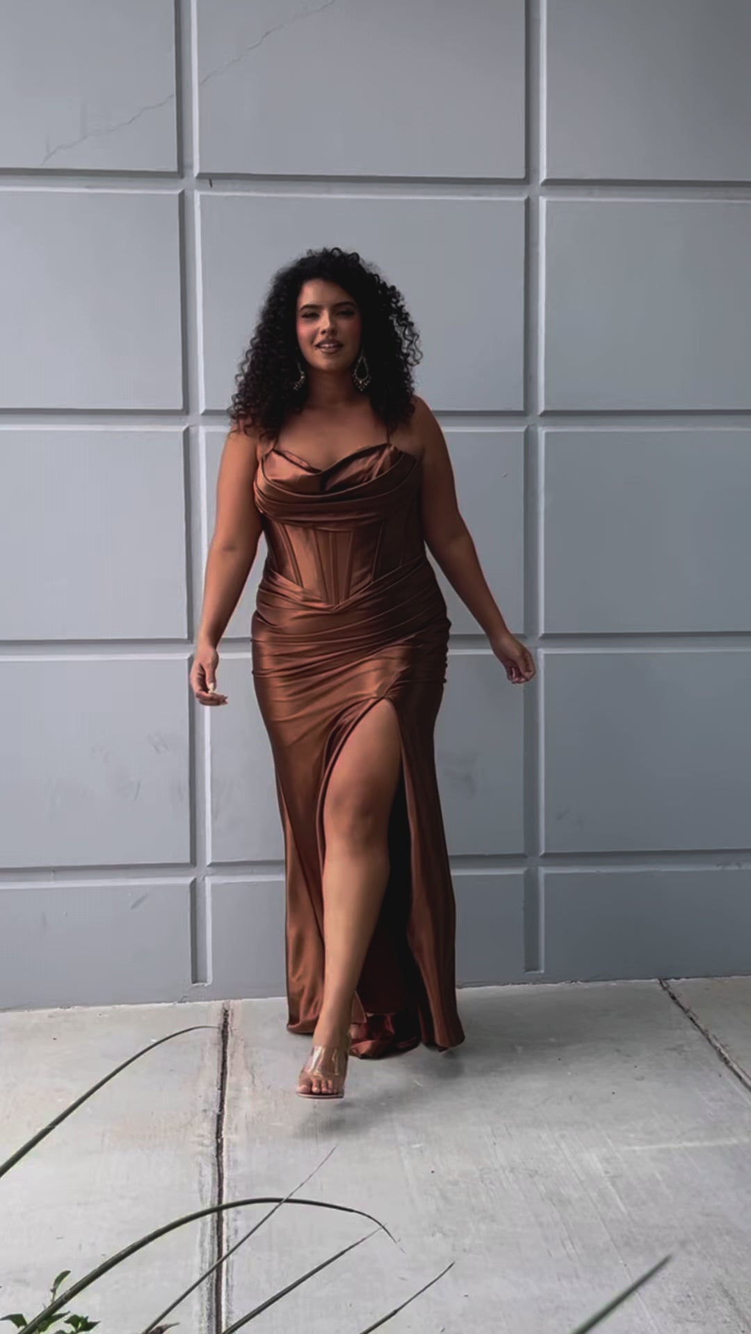 Simple plus size satin slim a-line fitted dress.  Spaghetti straps, pleated bodice, exposed boning corset with basque waistline.  Slim, fitted skirt with ruching. Lace-up back with modesty panel and sweep train.  Available in cherry red, chocolate brown, hunter green and onyx black. Sydney's Closet plus size style SC7426.