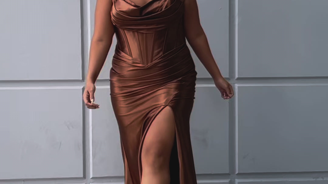 Simple plus size satin slim a-line fitted dress.  Spaghetti straps, pleated bodice, exposed boning corset with basque waistline.  Slim, fitted skirt with ruching. Lace-up back with modesty panel and sweep train.  Available in cherry red, chocolate brown, hunter green and onyx black. Sydney's Closet plus size style SC7426.