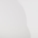 Woman models a slim navy dress with a slit, exposed corset boning, a pleated band over the bust, and rhinestones along the neckline, showing the front and back before walking off screen.