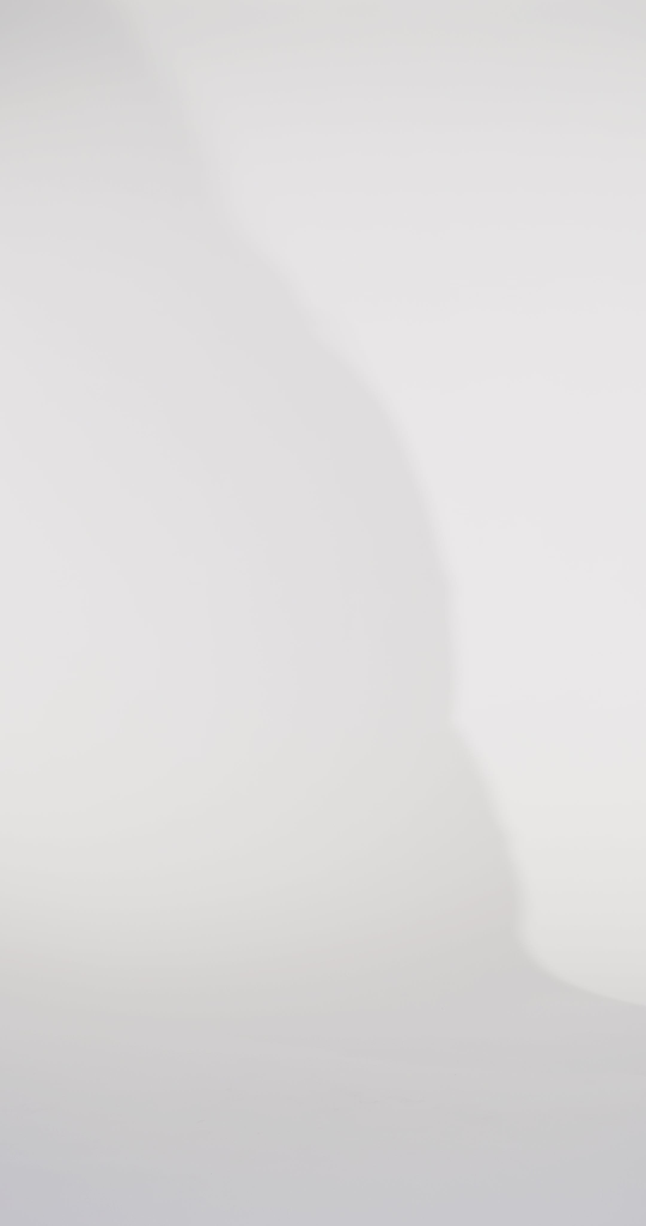 Woman models a slim navy dress with a slit, exposed corset boning, a pleated band over the bust, and rhinestones along the neckline, showing the front and back before walking off screen.