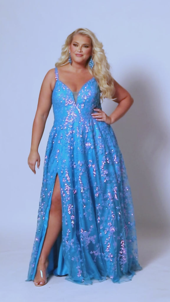 Tease Prom TE2433, Plus size A-line dress with iridescent blue sequins, v-neck, sequin covered straps, slit, bicep to wrist puff sleeves.