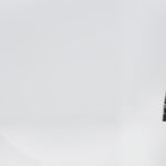 Plus size little black dress made of Guipure lace. Cap sleeves, scoop neckline and center back zipper. CE2601 available in sizes 14-24 in black. Celebrations by Sydney's Closet.