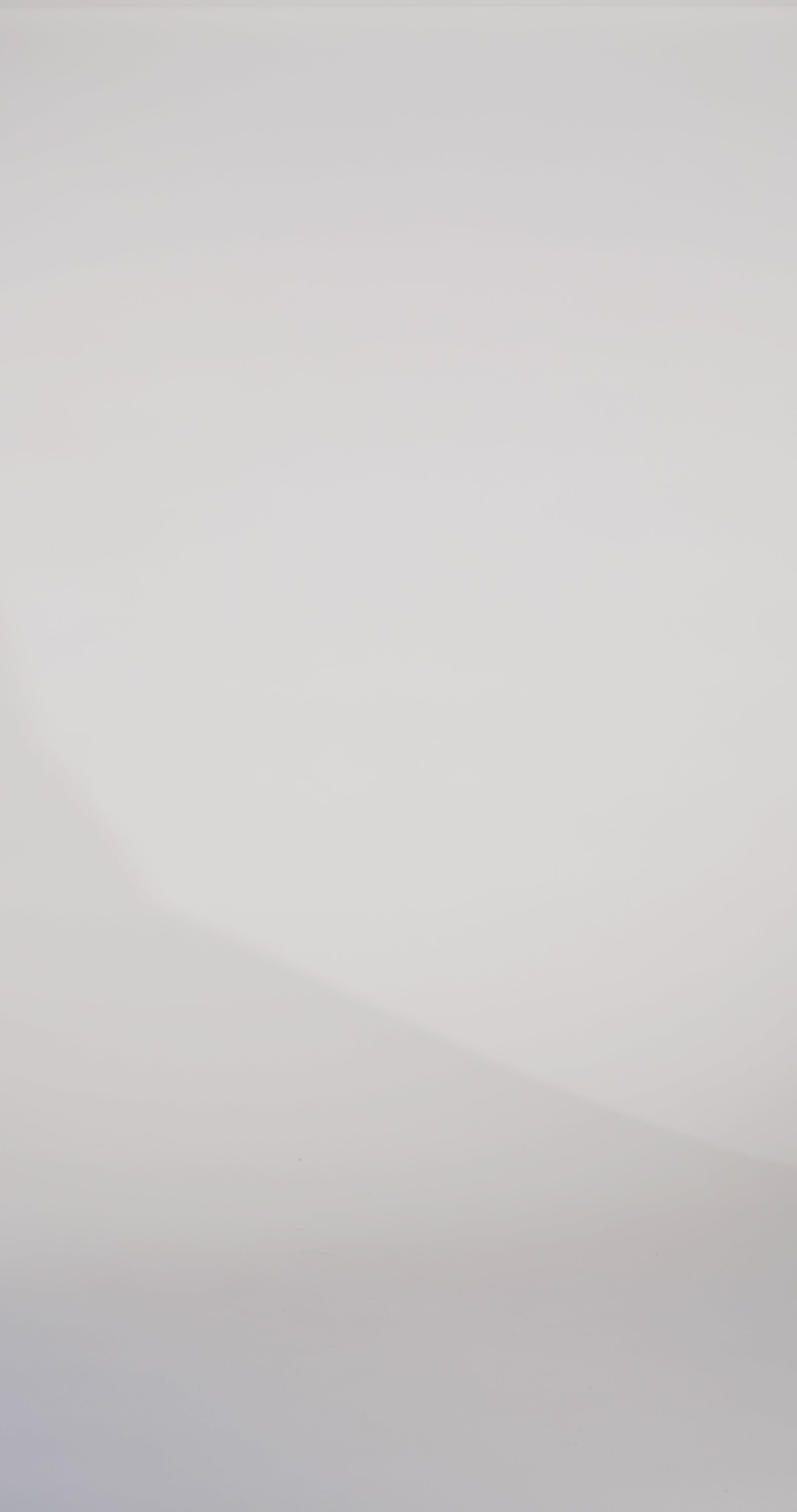 Woman models a navy strapless satin ballgown with a deep V-neck and sequin and beaded detailing flowing from the bodice onto the skirt, showing the front and lace-up back before walking off screen.