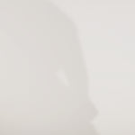 Woman models a green satin slim dress with a slit, off-the-shoulder sleeves, sequin appliqués, beading, and a lace-up back, showing the front and back before walking off screen.