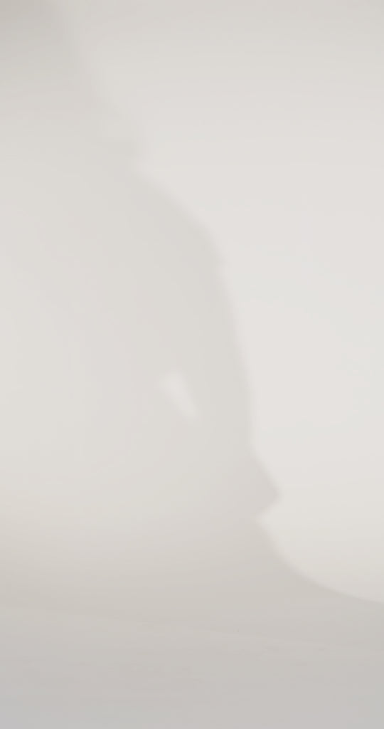 Woman models a green satin slim dress with a slit, off-the-shoulder sleeves, sequin appliqués, beading, and a lace-up back, showing the front and back before walking off screen.