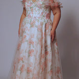 Tease Prom style TE2527 plus size floral prom dress. Printed floral organza with sequin floral leaf appliques.  Spaghetti straps with drape flutter sleeve. Exposed corset boning on bodice. A-line skirt with long invisible center back zipper. 