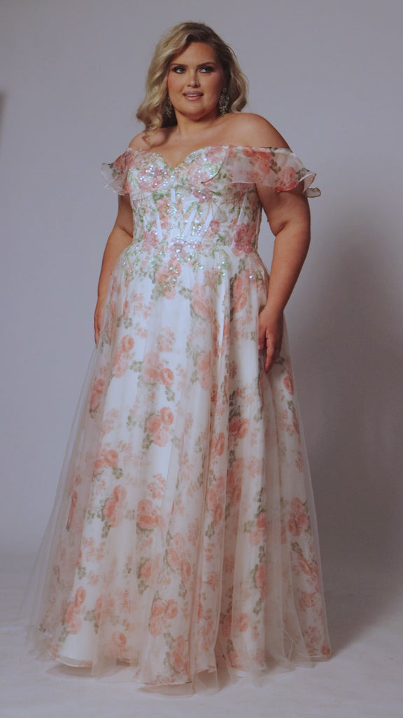 Tease Prom style TE2527 plus size floral prom dress. Printed floral organza with sequin floral leaf appliques.  Spaghetti straps with drape flutter sleeve. Exposed corset boning on bodice. A-line skirt with long invisible center back zipper. 