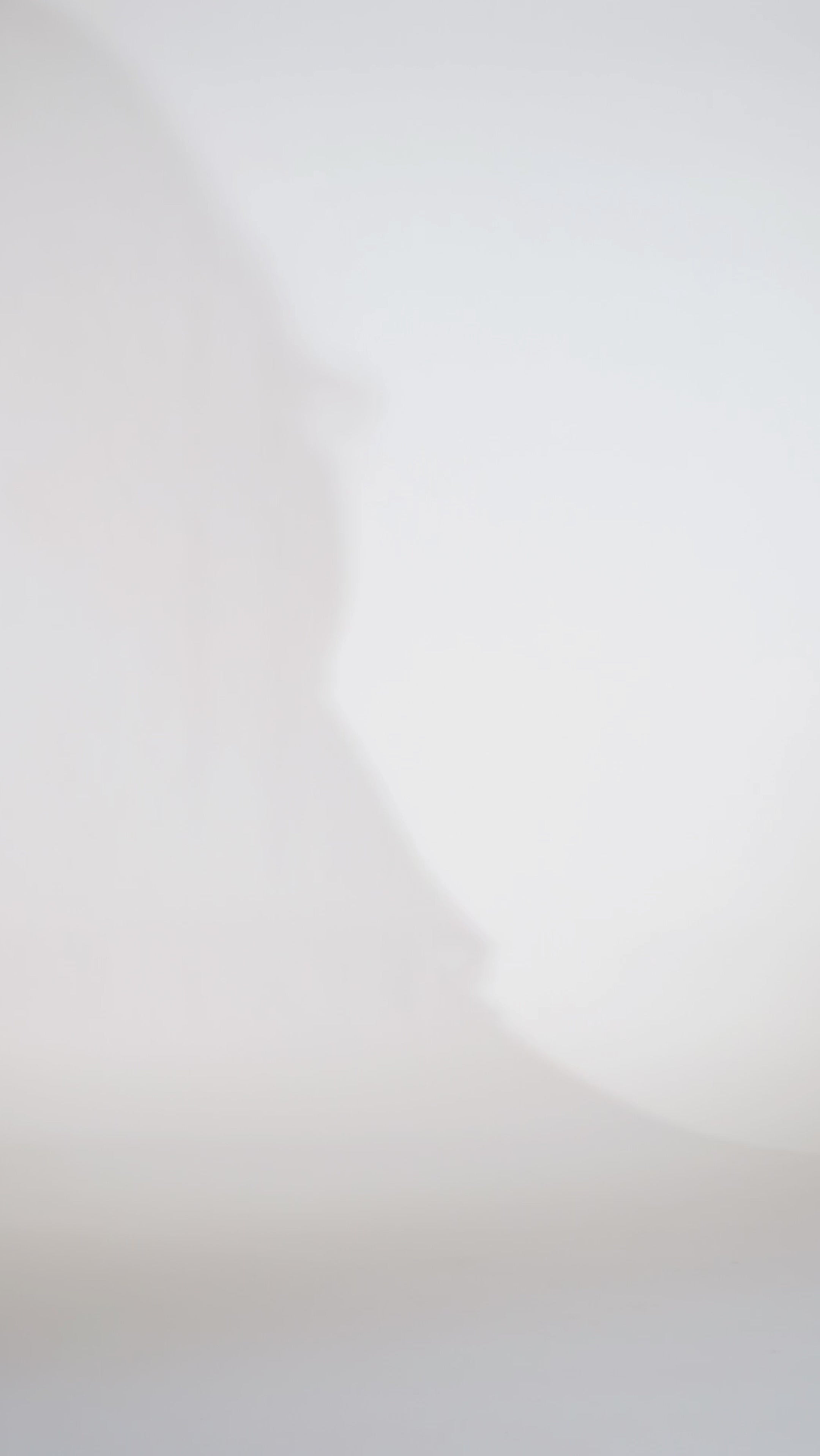 Boho crochet lace plus size wedding dress with V-neckline, illusion lace straps, illusion long flowy bell sleeves, natural wiasltine and slim A-line skirt finished with scalloped eyelash hem.  Available in ivory. Celebrations by Sydney's Closet style CE2604