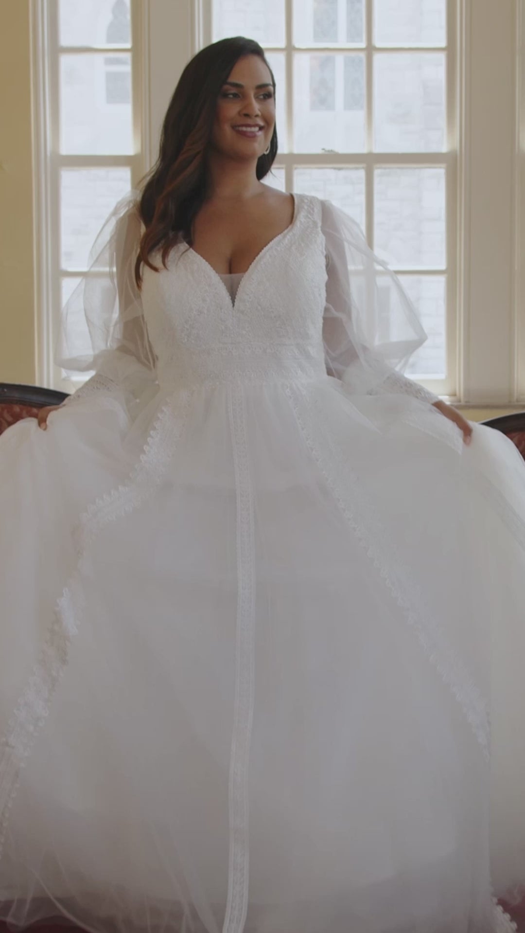 Michelle Bridal MB2429 Ivory. Bridal tulle, bridal tulle, Satin lining, Appliques = Embroidered lace appliques, Guipure Lace trim, Silhouette: A-line, V-neckline, Ivory mesh insert Detachable, Puff Sleeve = long sleeve with cuff, Front bodice is lined, Back bodice has optional lining with snaps, Natural waistline.