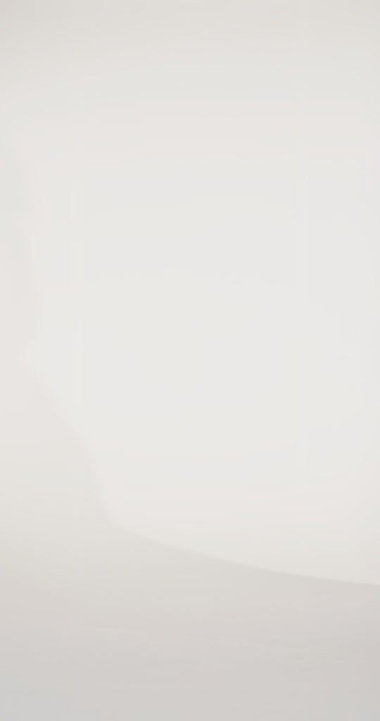 Woman models a simple blue slim sparkly dress with spaghetti straps, a sweetheart neckline, and a slit, turning to show the lace-up back before walking off screen.