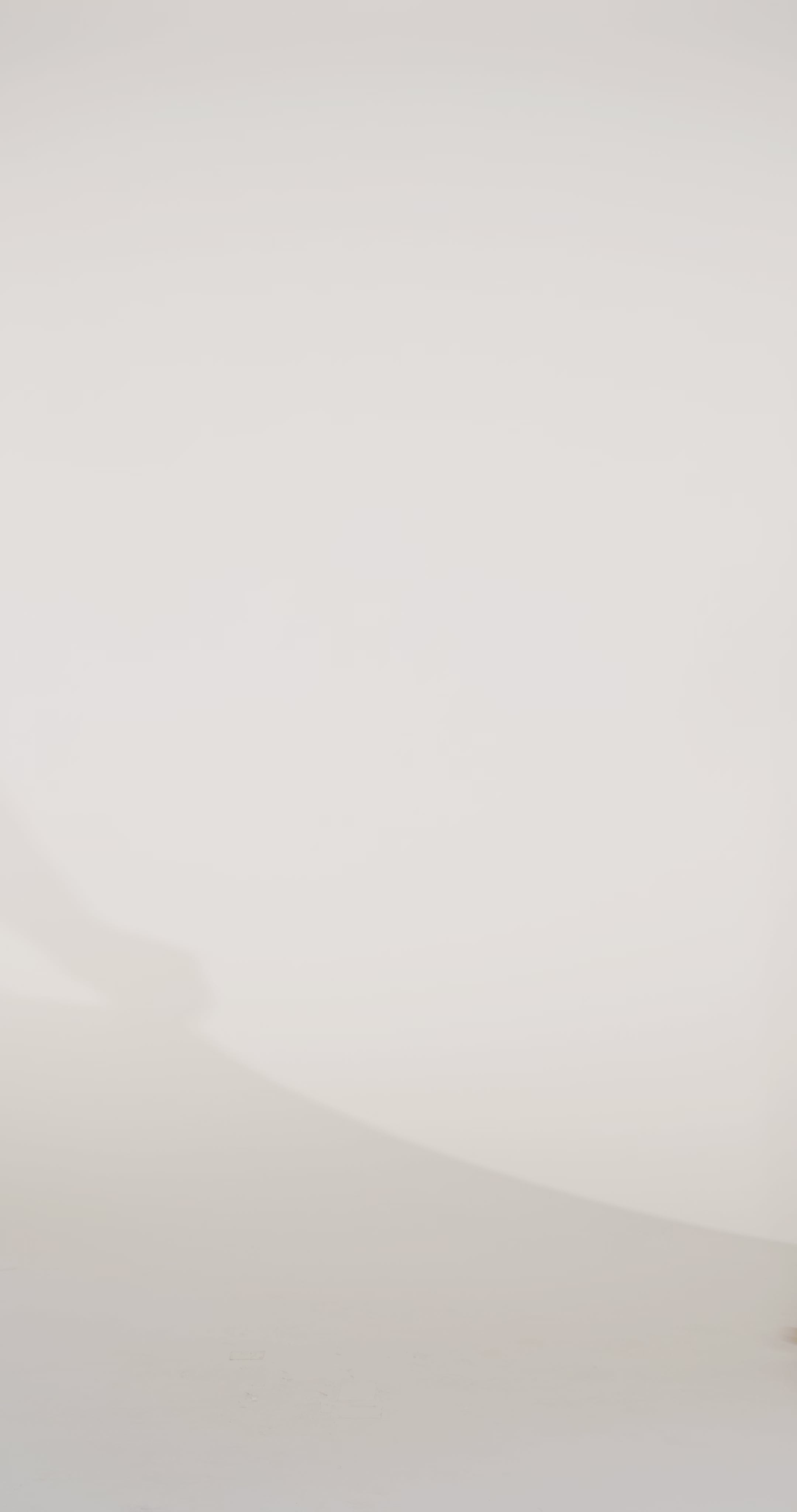 Woman models an ivory dress with a pink floral print and sequin-accented bodice, showing the front and back before walking off screen.