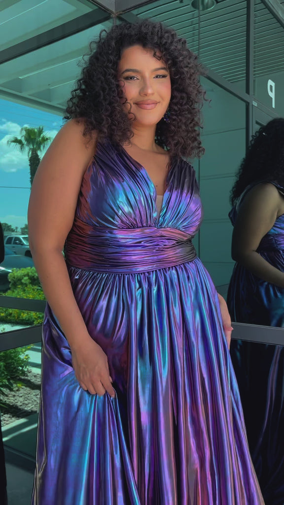 Best selling plus size A-line prom, formal and evening dress. Metallic stretch knit novelty fabric, bra-friendly straps, full A-line skirt and pockets. Available in peacock (blue/green) and Prism (blue/purple) sizes 14-40. SC7415 by Sydney's Closet