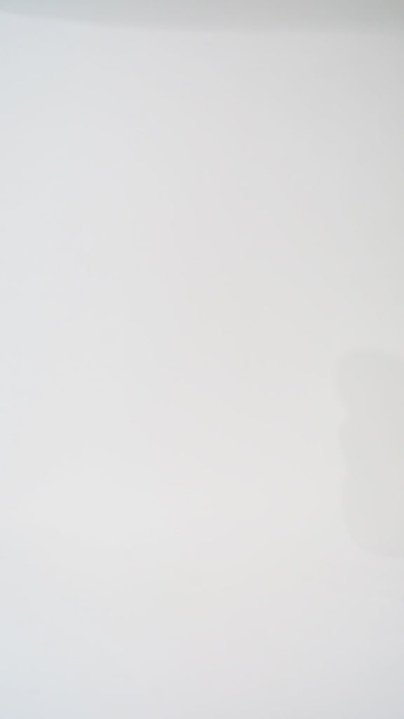 Woman models a pink off-the-shoulder A-line dress with a floral pattern, turning to show the back before walking off screen.