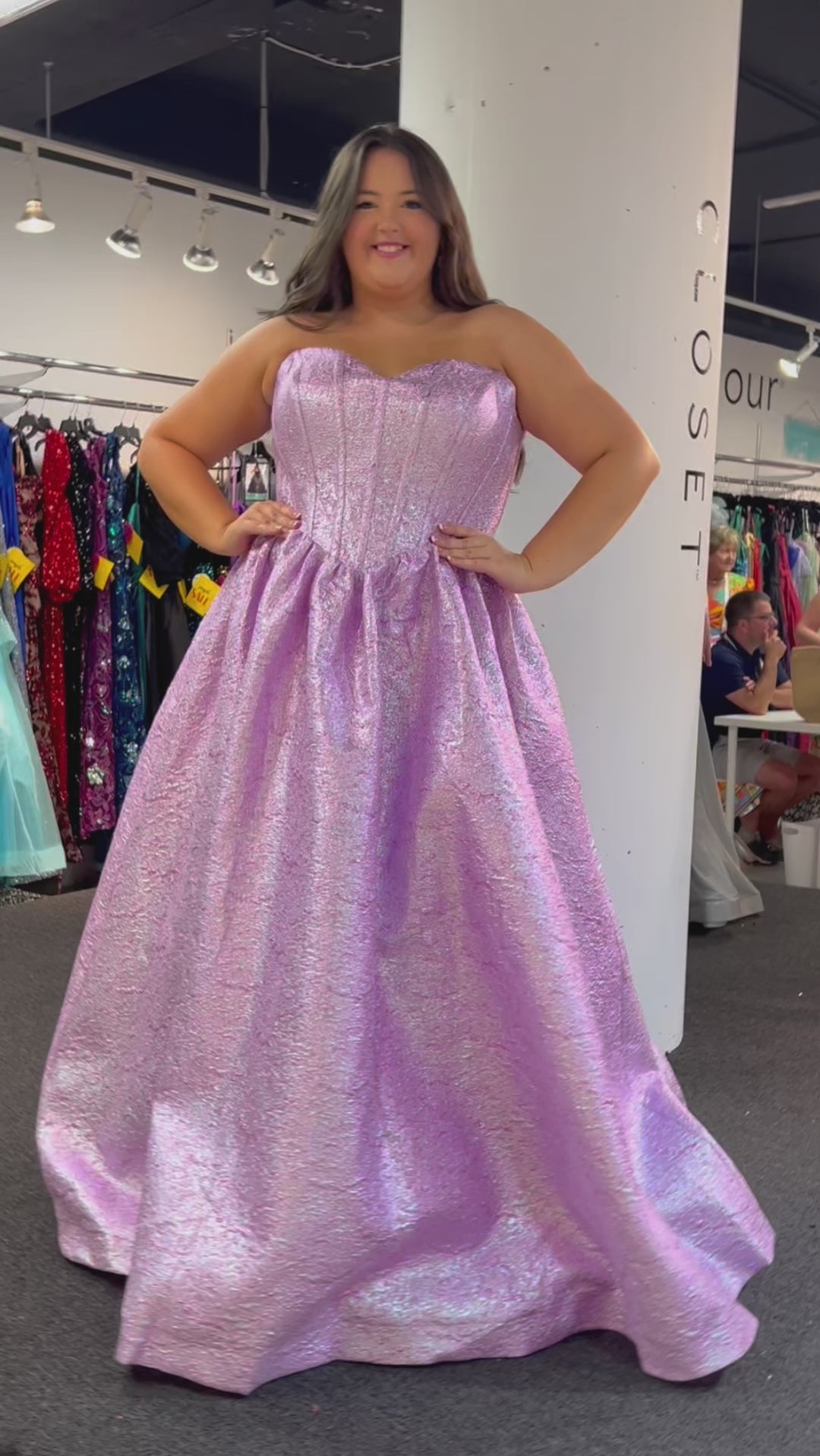 Tease Prom for Sydney's Closet style TE2538 available inamethyst purple and topaz blue. Plus size ballgown with strapless sweetheart bodice, exposed boning, basque waist and full A-line skirt with pockets. Lace up back with modesty panel and ties.