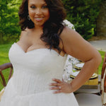 Michelle Bridal MB2605. Strapless A-line gown with bodice drape detail, exposed boning, basque waistline and soft tulle A-Line skirt. Large embroidered organza appliques. Center back zipper. 