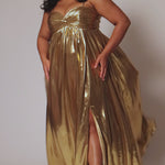 Empire plus size formal dress with spaghetti straps, pleated bodice with knot detail, pockets and slit. Available in gold, onyx black and ruby red. SC7414 by Sydney's Closet