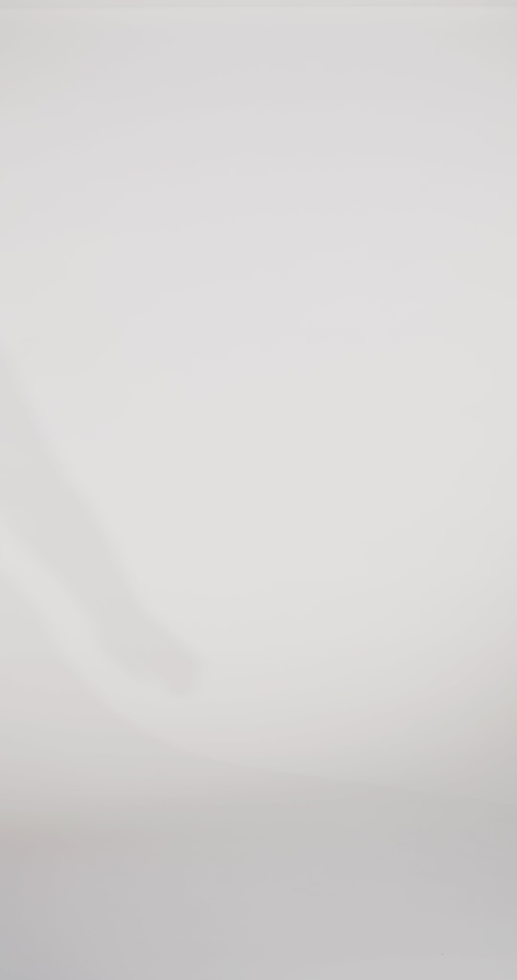 Woman models a simple green slim sparkly dress with spaghetti straps, a sweetheart neckline, and a slit, turning to show the lace-up back before walking off screen.