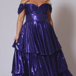 Plus size metallic tiered prom dress.  Strapless bodice with pleating and exposed boning. Detachable pleated drape sleeves. Available in fuchsia pink, indigo dark blue and onyx black. Style TE2510 by Tease Prom.