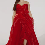 Johnathan Kayne for Sydney's Closet style JK2608.

Strapless sweetheart plus size A-line gown.  Ruched bodice with bow at natural waistline and flounce down left leg slit. Shiny organza fabric for lightweight comfort. Available in sizes  10-32 in Red, Black and Blue. 