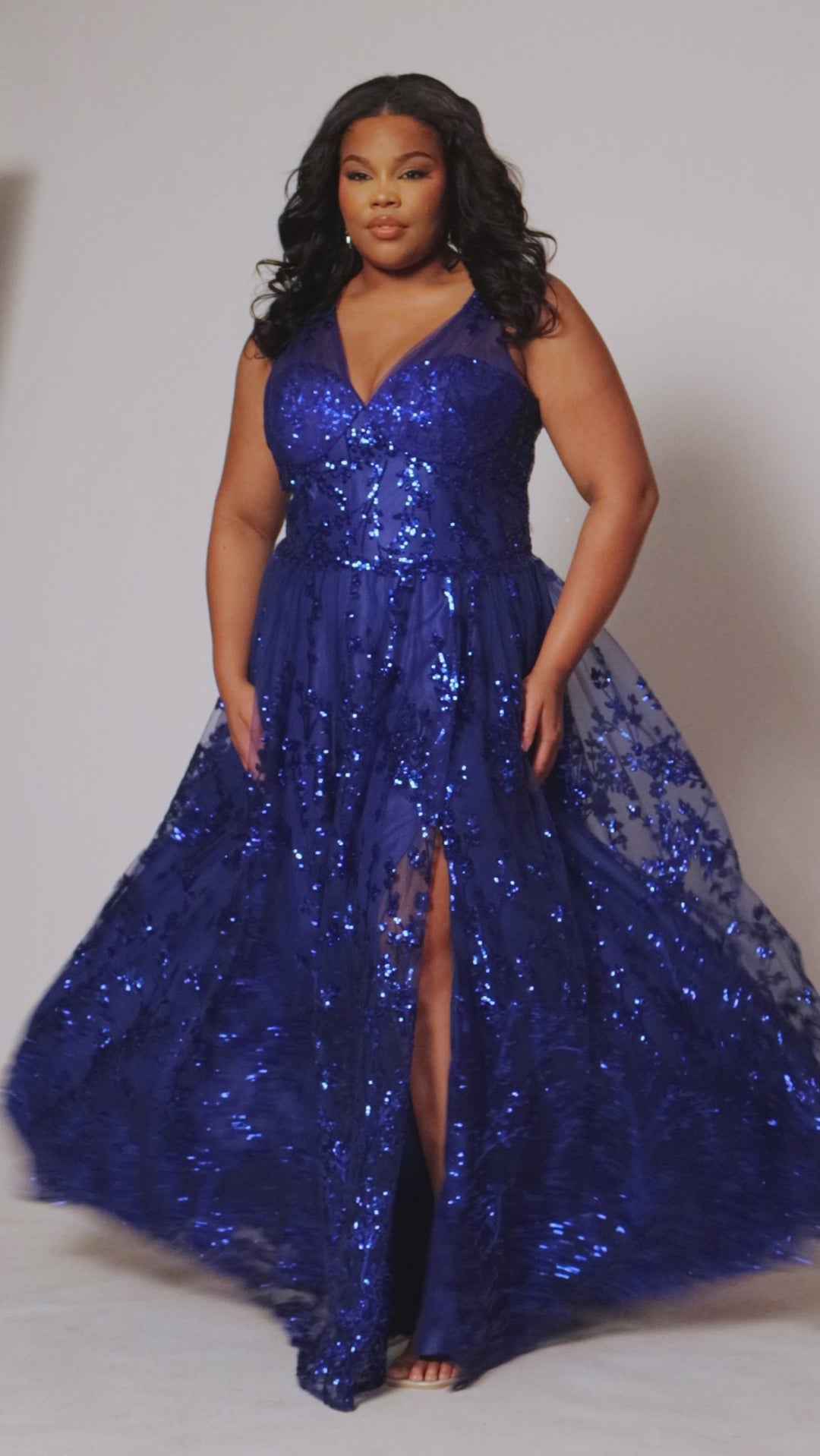 Plus size prom dress style TE2537 by Tease Prom available in Sapphire blue or Orchid purple.  Pleated illusion straps cover a sweetheart bodice with exposed corset boning. Full A-line skirt with slit and glitter sequin appliques on tulle mesh. 